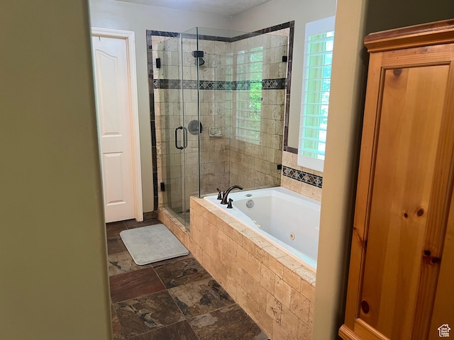93 E Sweet Berry Ct, Draper, UT 84020 - full bath with a whirlpool tub, a shower stall, and stone finish flooring