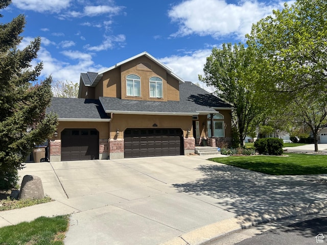 93 E Sweet Berry Ct, Draper, UT 84020 - view of front of home featuring stucco siding, driveway, roof with shingles, and a front yard