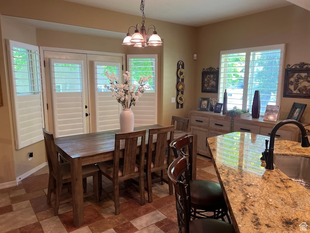 93 E Sweet Berry Ct, Draper, UT 84020 - dining area featuring healthy amount of natural light, a chandelier, and baseboards