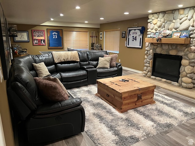93 E Sweet Berry Ct, Draper, UT 84020 - living room with wood finished floors, recessed lighting, a stone fireplace, and baseboards