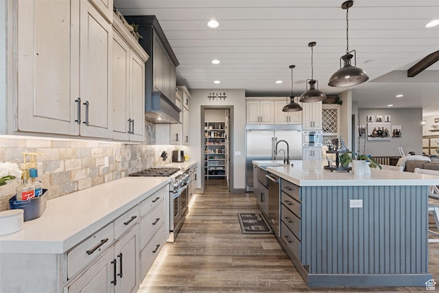 15113 S Cedar Meadow Cir, Herriman, UT 84096 - kitchen with high quality appliances, recessed lighting, wood finished floors, light countertops, and decorative light fixtures