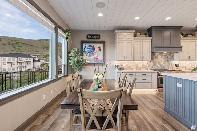 15113 S Cedar Meadow Cir, Herriman, UT 84096 - dining space with plenty of natural light, recessed lighting, a mountain view, light wood finished floors, and wooden ceiling