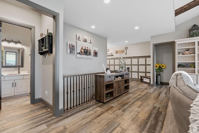 15113 S Cedar Meadow Cir, Herriman, UT 84096 - hallway featuring light wood-style flooring, recessed lighting, baseboards, and a sink