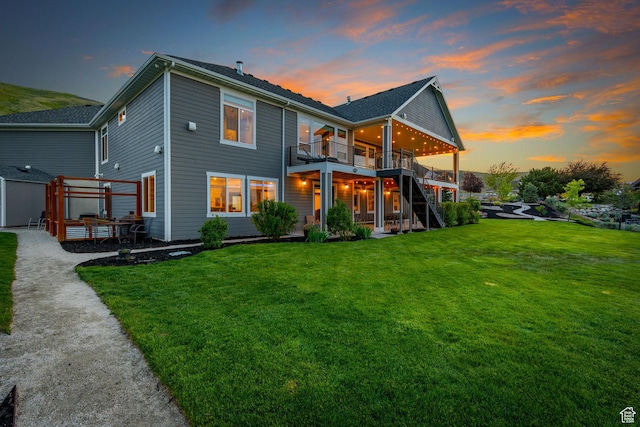 15113 S Cedar Meadow Cir, Herriman, UT 84096 - back of property featuring a wooden deck, a lawn, stairs, and a patio
