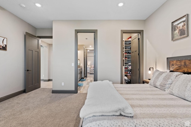 15113 S Cedar Meadow Cir, Herriman, UT 84096 - bedroom featuring a spacious closet, light carpet, recessed lighting, baseboards, and ensuite bathroom
