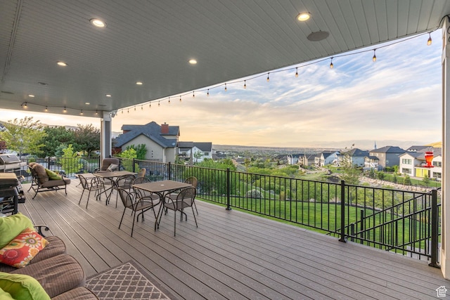 15113 S Cedar Meadow Cir, Herriman, UT 84096 - deck at dusk featuring outdoor dining area and a residential view