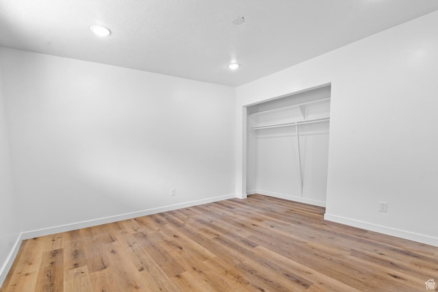 2091 N 1060 W, Provo, UT 84604 - unfurnished bedroom featuring light wood-style floors, baseboards, a closet, and recessed lighting
