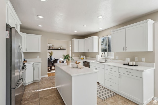 926 N 600 W, American Fork, UT 84003 - kitchen featuring appliances with stainless steel finishes, a sink, recessed lighting, white cabinetry, and light countertops