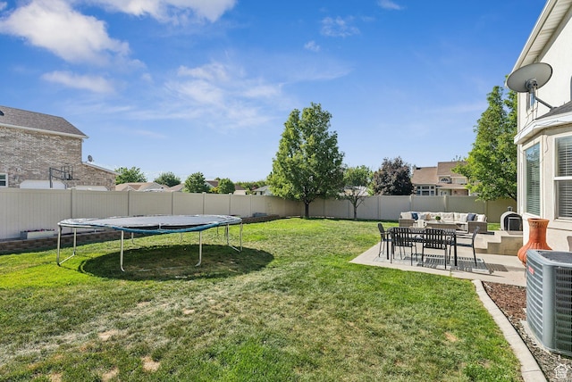 926 N 600 W, American Fork, UT 84003 - view of yard featuring an outdoor living space, a trampoline, central air condition unit, and a patio area
