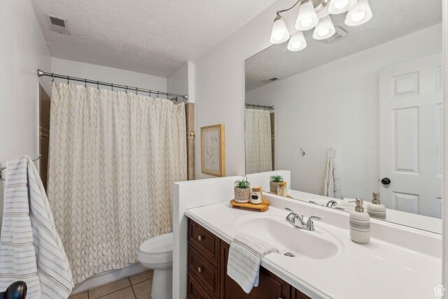926 N 600 W, American Fork, UT 84003 - bathroom featuring toilet, vanity, tile patterned flooring, a chandelier, and a textured ceiling