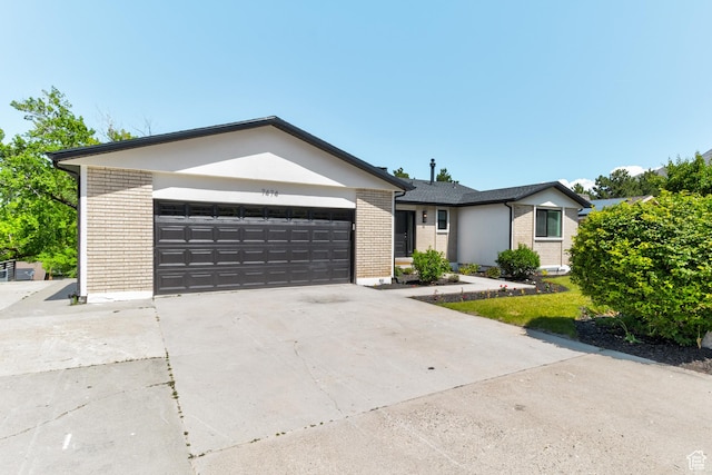 7474 S Brighton Way, Cottonwood Heights, UT 84121 - ranch-style home featuring brick siding, a garage, and concrete driveway