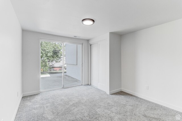 7474 S Brighton Way, Cottonwood Heights, UT 84121 - unfurnished bedroom featuring access to outside, carpet flooring, baseboards, and a closet