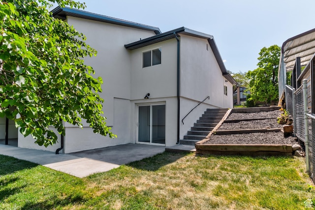 7474 S Brighton Way, Cottonwood Heights, UT 84121 - rear view of property with stairs, a lawn, stucco siding, and a patio