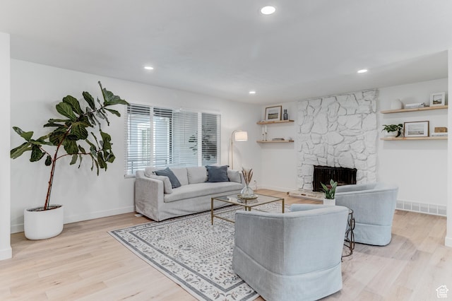 7474 S Brighton Way, Cottonwood Heights, UT 84121 - living room with wood finished floors, a stone fireplace, baseboards, and recessed lighting