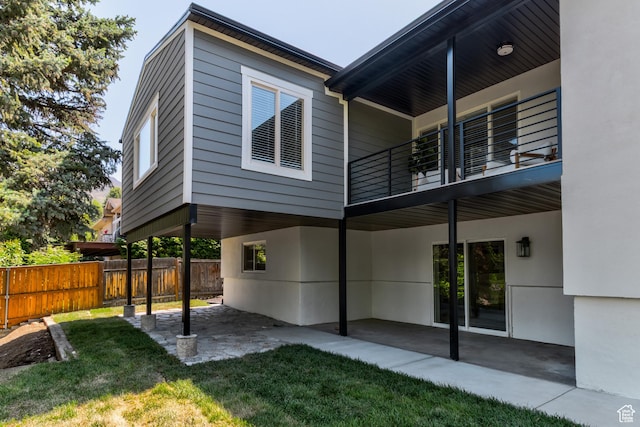 7474 S Brighton Way, Cottonwood Heights, UT 84121 - back of house featuring a balcony, a patio area, and stucco siding