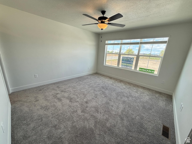 3664 S 4600 W Unit 222, West Haven, UT 84401 - empty room with a textured ceiling, baseboards, a ceiling fan, and carpet flooring