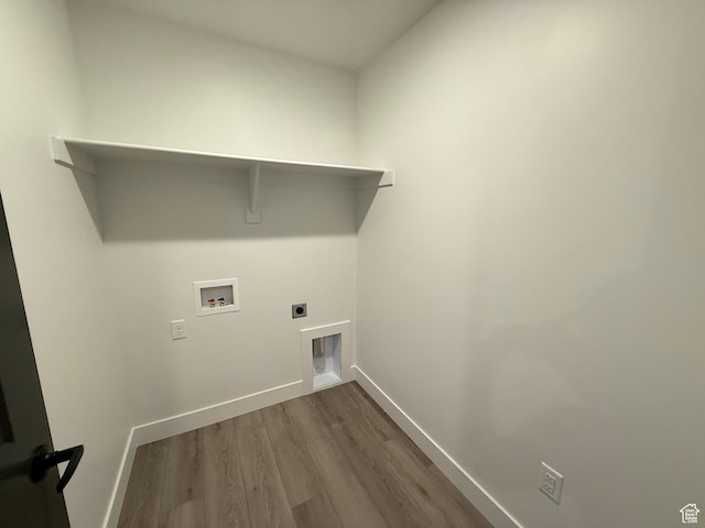 3664 S 4600 W Unit 222, West Haven, UT 84401 - washroom with washer hookup, hookup for an electric dryer, dark wood-style flooring, and baseboards