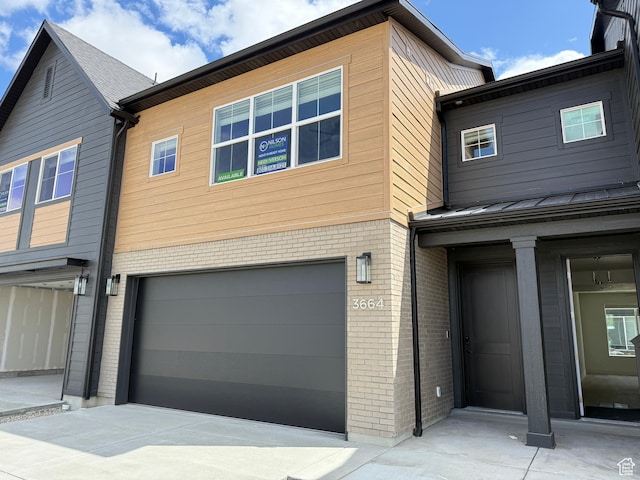 3664 S 4600 W Unit 222, West Haven, UT 84401 - view of front of home featuring a garage and brick siding