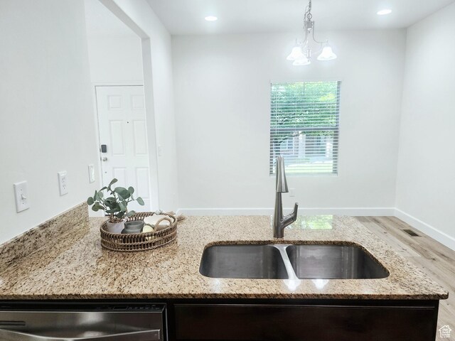 246 E Topspin Way, Lehi, UT 84043 - kitchen featuring a sink, dishwasher, wood finished floors, light stone counters, and recessed lighting