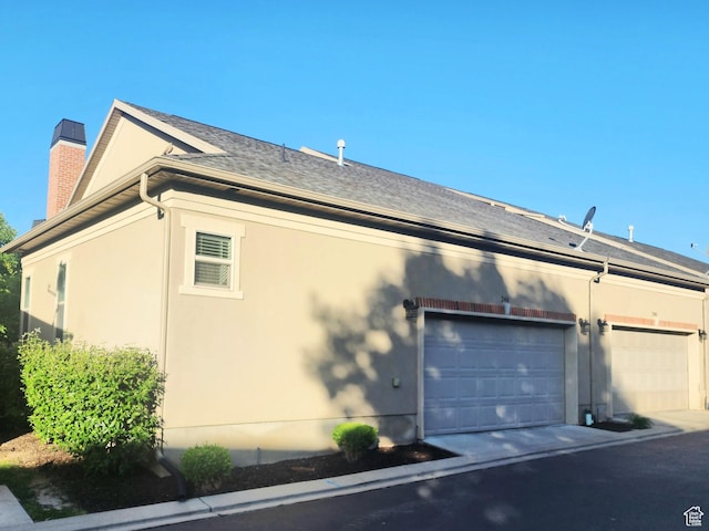 246 E Topspin Way, Lehi, UT 84043 - view of home's exterior featuring stucco siding, a chimney, and roof with shingles