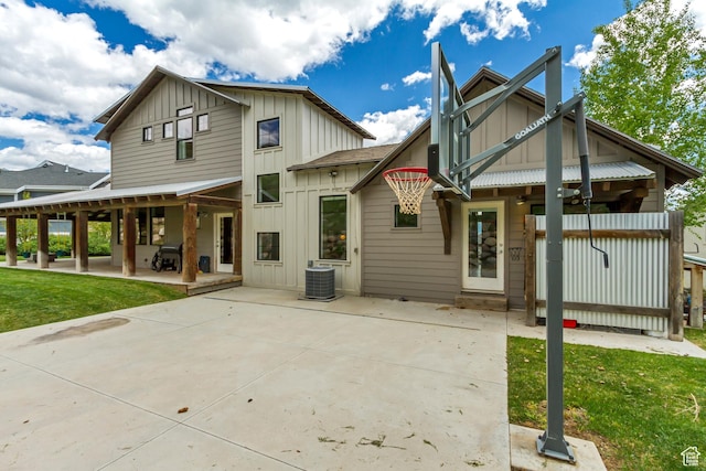 1685 N 300 E, Midway, UT 84049 - back of house with board and batten siding, central AC, a patio area, and a yard