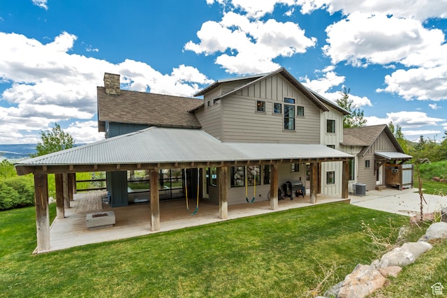 1685 N 300 E, Midway, UT 84049 - rear view of house with board and batten siding, a patio, and a yard