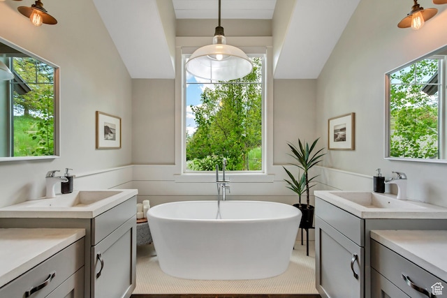 1685 N 300 E, Midway, UT 84049 - bathroom with two vanities, a freestanding tub, and plenty of natural light