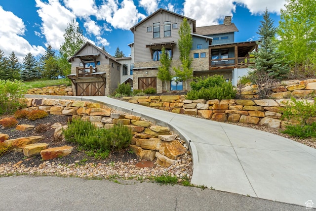 1685 N 300 E, Midway, UT 84049 - view of front facade featuring board and batten siding, stone siding, and a chimney