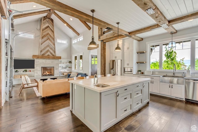 1685 N 300 E, Midway, UT 84049 - kitchen featuring a sink, stainless steel appliances, beam ceiling, white cabinetry, and healthy amount of natural light