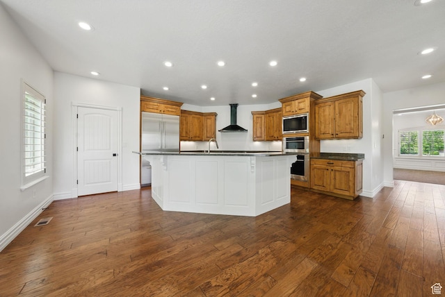 3444 N 180 E, Provo, UT 84604 - kitchen featuring built in appliances, wall chimney range hood, dark countertops, brown cabinetry, and recessed lighting