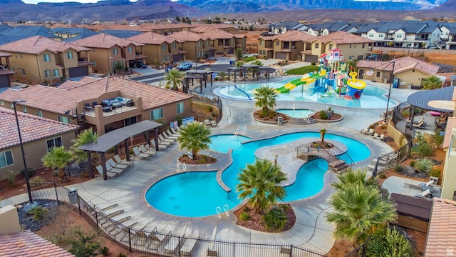 3800 Paradise Village Dr Unit 84, Santa Clara, UT 84765 - community pool with a water play area, a residential view, a mountain view, and a water slide