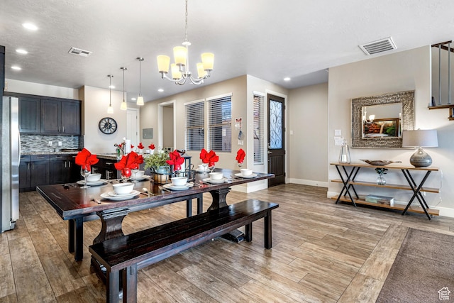 3800 Paradise Village Dr Unit 84, Santa Clara, UT 84765 - dining space featuring light wood-style floors, recessed lighting, baseboards, and a chandelier