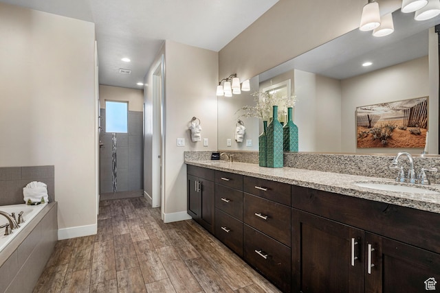 3800 Paradise Village Dr Unit 84, Santa Clara, UT 84765 - full bath featuring wood finished floors, double vanity, a bath, and baseboards