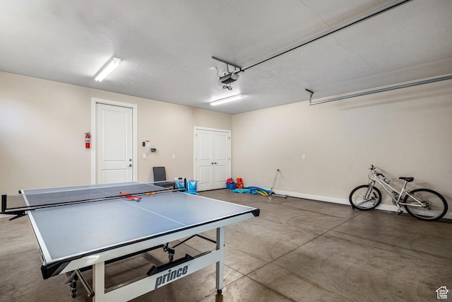 3800 Paradise Village Dr Unit 84, Santa Clara, UT 84765 - rec room with a garage, concrete flooring, and baseboards