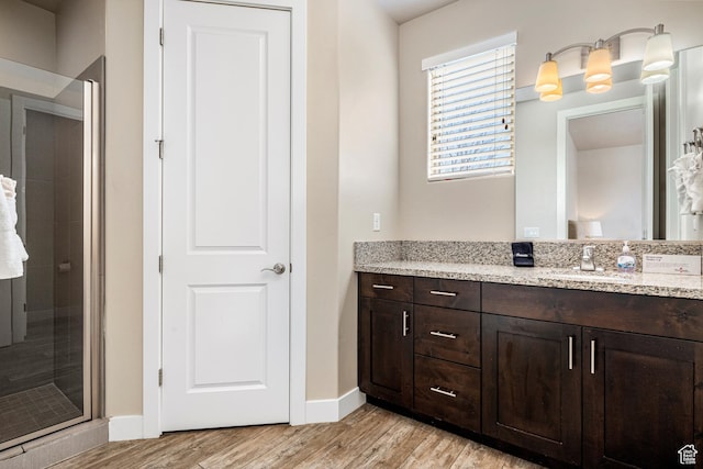 3800 Paradise Village Dr Unit 84, Santa Clara, UT 84765 - full bathroom featuring vanity, wood finished floors, baseboards, and a shower stall
