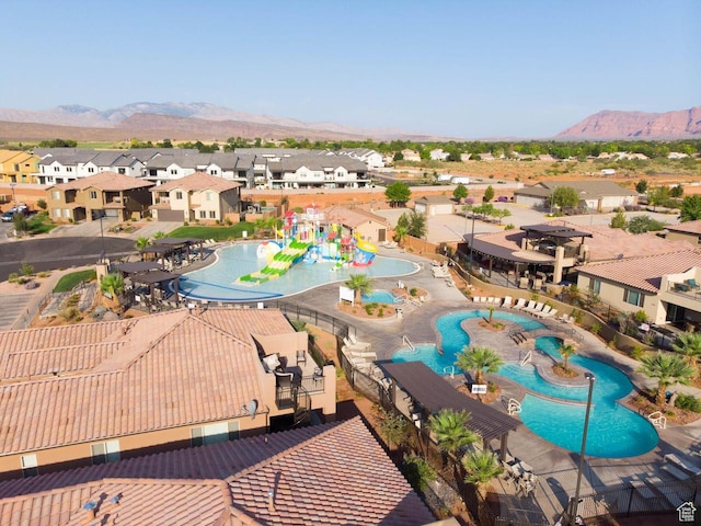 3800 Paradise Village Dr Unit 84, Santa Clara, UT 84765 - aerial perspective of suburban area with a pool area and a mountain backdrop