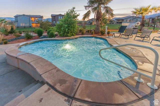 3800 Paradise Village Dr Unit 84, Santa Clara, UT 84765 - pool at dusk with a patio