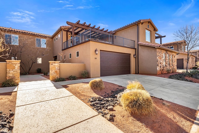 3800 Paradise Village Dr Unit 84, Santa Clara, UT 84765 - view of front of home featuring a balcony, stucco siding, a tiled roof, concrete driveway, and a garage