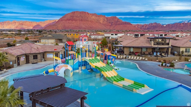 3800 Paradise Village Dr Unit 84, Santa Clara, UT 84765 - community pool featuring a water play area, a residential view, and a mountain view