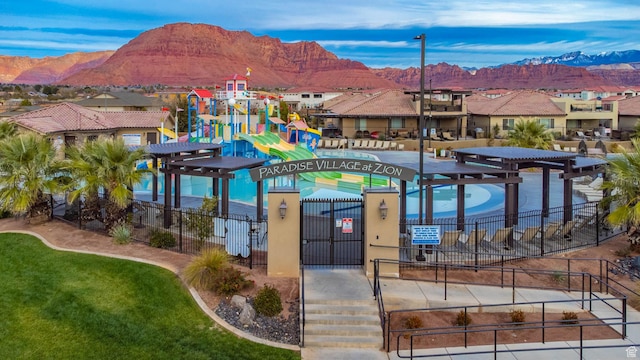 3800 Paradise Village Dr Unit 84, Santa Clara, UT 84765 - view of swimming pool with a mountain view, a residential view, and a pergola