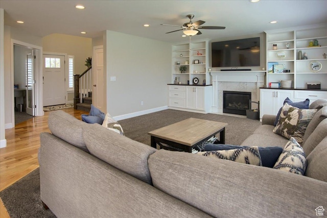 2321 W Harmony Dr S, Layton, UT 84041 - living room with stairway, baseboards, a fireplace, ceiling fan, and recessed lighting