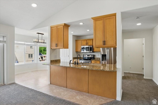 5167 N Rodeo Cir Unit 6, Oakley, UT 84055 - kitchen with appliances with stainless steel finishes, light carpet, a sink, dark stone countertops, and recessed lighting