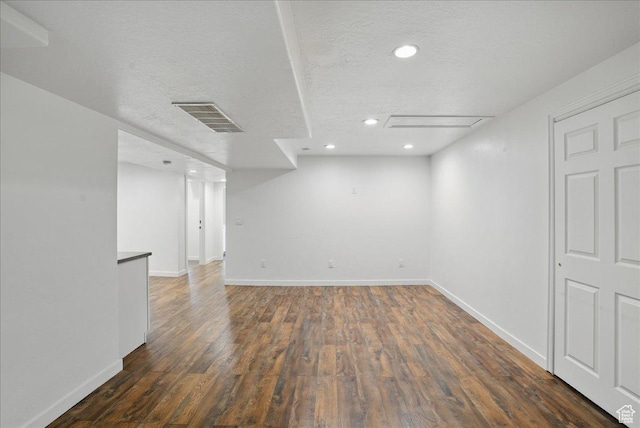 5167 N Rodeo Cir Unit 6, Oakley, UT 84055 - finished below grade area featuring a textured ceiling, wood finished floors, baseboards, and recessed lighting