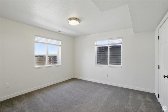5167 N Rodeo Cir Unit 6, Oakley, UT 84055 - unfurnished bedroom featuring dark carpet and baseboards