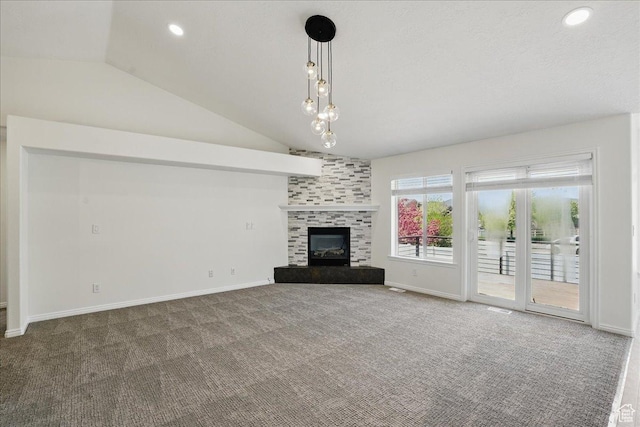 5167 N Rodeo Cir Unit 6, Oakley, UT 84055 - unfurnished living room with lofted ceiling, carpet, a fireplace, baseboards, and recessed lighting