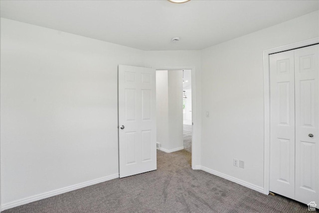 5167 N Rodeo Cir Unit 6, Oakley, UT 84055 - unfurnished bedroom with carpet floors, baseboards, and a closet