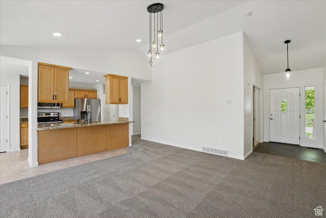 5167 N Rodeo Cir Unit 6, Oakley, UT 84055 - kitchen featuring appliances with stainless steel finishes, open floor plan, light stone countertops, hanging light fixtures, and recessed lighting