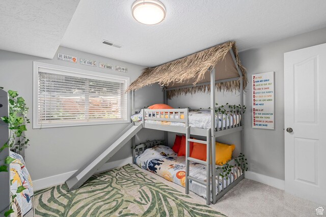 10927 S Lostwood Dr, Sandy, UT 84092 - carpeted bedroom featuring baseboards and a textured ceiling