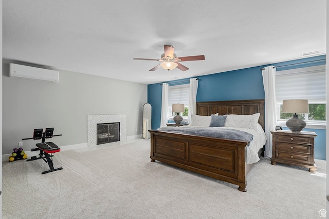 10927 S Lostwood Dr, Sandy, UT 84092 - bedroom featuring an AC wall unit, carpet floors, a fireplace, and baseboards