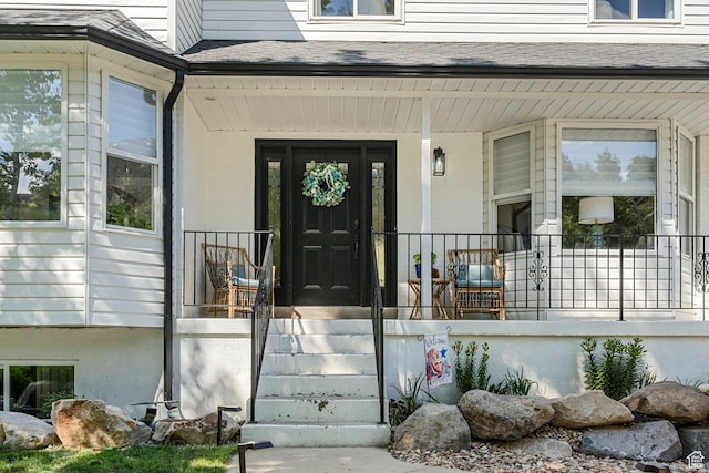 10927 S Lostwood Dr, Sandy, UT 84092 - doorway to property featuring covered porch and a shingled roof
